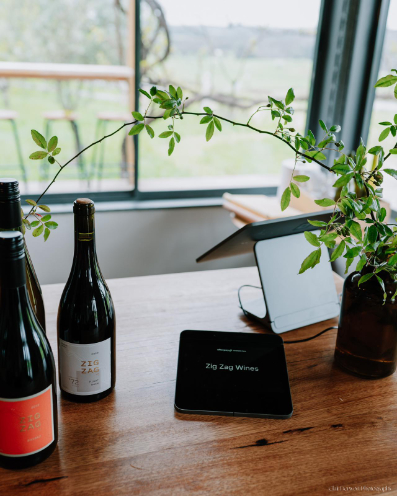 Zig Zag Wines Cellar Door bar and bottles with vine in vase